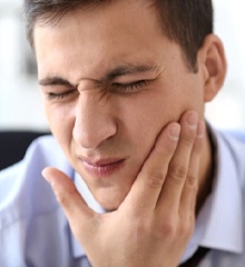 Closeup of man experiencing tooth pain