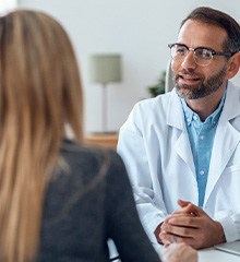 dentist and patient having dental implant consultation